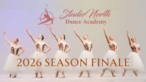 Six ballet dancers in white tutus pose on stage with arms raised. The text reads “Studio North Season Finale Showcase 2026” with a compass and dancer logo above.