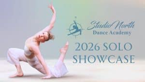 A dancer in white strikes a dramatic floor pose for the Solo Showcase. Text reads: "Studio North Dance Academy 2026 Solo Showcase" beside a logo featuring a dancer and compass against a softly colored, pale background.