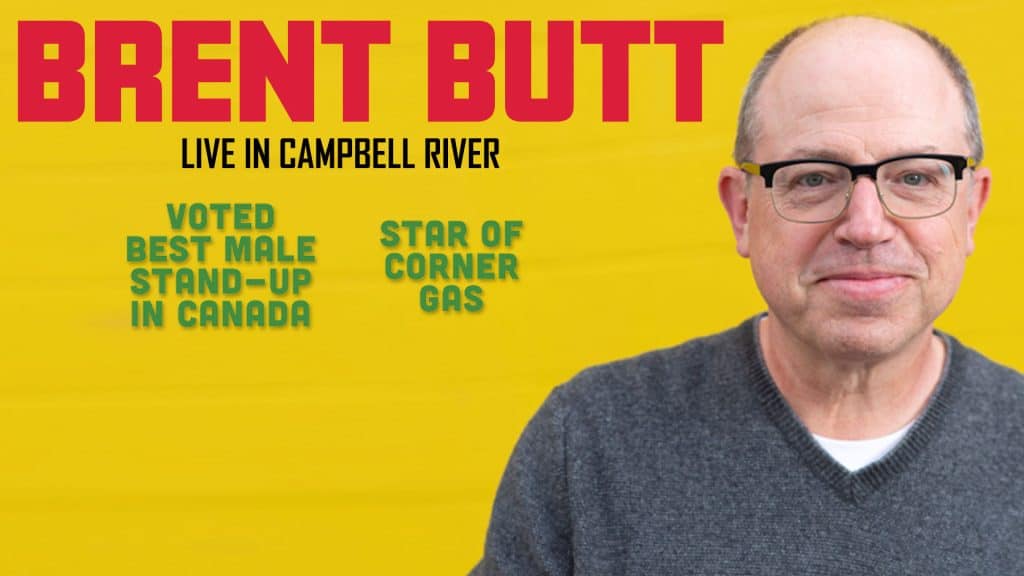 A man with glasses and a grey sweater smiles at the camera. Text reads: "BRENT BUTT LIVE IN CAMPBELL RIVER. Voted best male stand-up in Canada. Star of Corner Gas." The background is yellow.