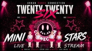Five young children in pink tutus stand in a row on stage with a sparkling background that reads "Urban Dance Connection Twenty Twenty Six Mini Stars Live Stream," perfectly capturing the excitement of the mini stars live stream event. Pink stars and spotlights frame the image.