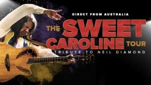 A performer strums a guitar on stage with text: “Direct from Australia. The Sweet Caroline Tour—Tribute to Neil Diamond.” Bold red and yellow letters stand out against a black background, capturing the vibrant energy of this unforgettable Sweet Caroline Tour.